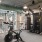 fitness center with large open spaces allowing room for workouts and for using equipment