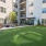 courtyard with modern seating and on lush turf lawn