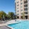 pool area with plenty of seating and bright blue water